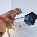 Image of Camera Installer with Drill and Camera