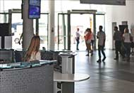 Image of people entering a busy office building